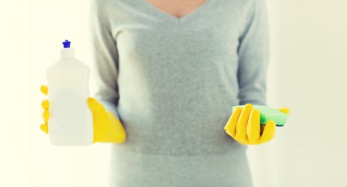 Cleaning and conditioning a leather sofa surface